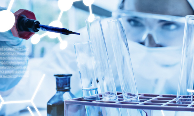 Protected female scientist dropping blue liquid in a test tube against science graphic