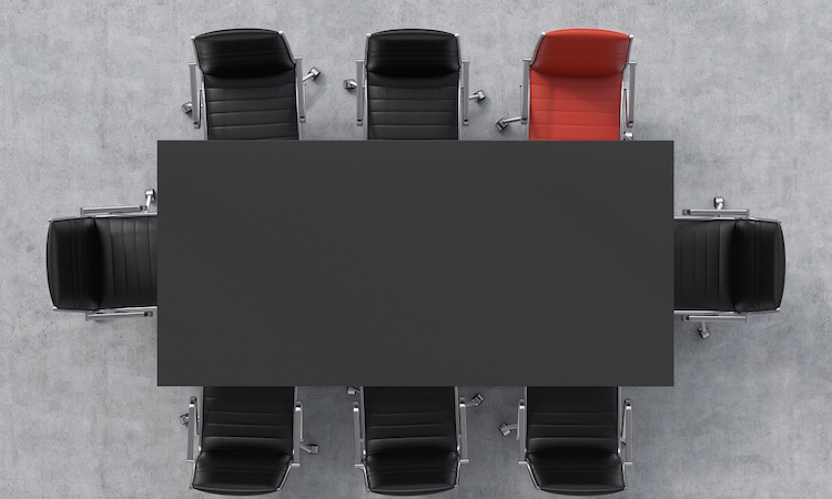 Top view of a conference room. A black rectangular table and eight chairs around, one of them is red. Office interior. 3D rendering.