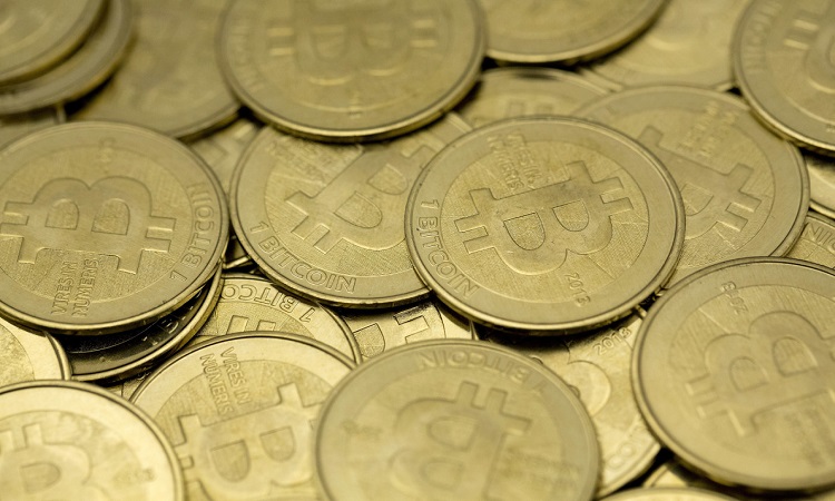 Some of Bitcoin enthusiast Mike Caldwell's coins are pictured at his office in this photo illustration in Sandy